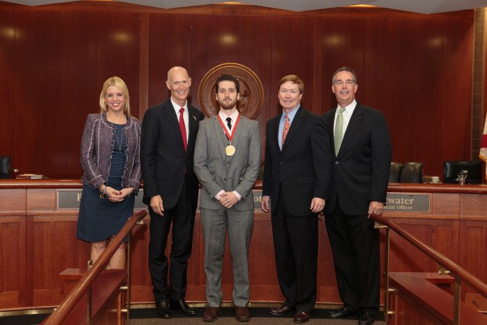 UF grad receives Young Entrepreneur award from Gov. Scott