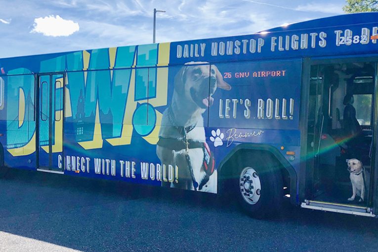Bus wrap advertising nonstop flights to DFW